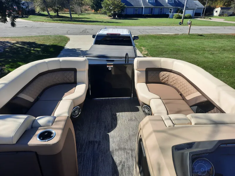 Slide: The Image of Interior of a 2022 Godfrey 23ft Tritoon boat with luxurious seating. - 3