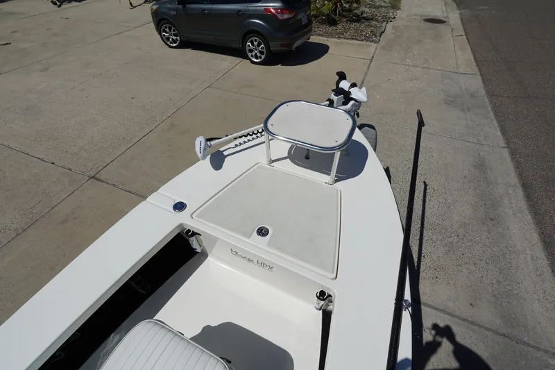 Slide: The Image of 2014 Maverick 17 HPX Tunnel boat on concrete driveway, featuring a sleek design. - 10