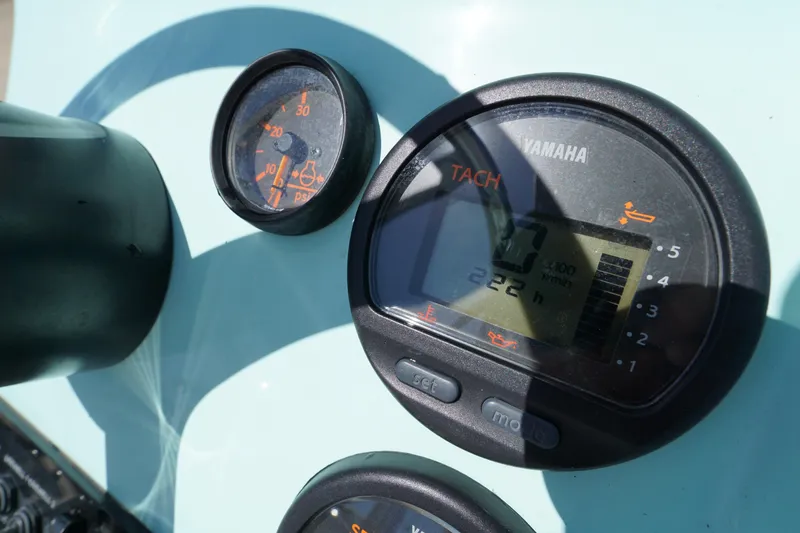 Slide: The Image of Close-up of Yamaha tachometer on 2014 Maverick 17 HPX Tunnel boat dashboard. - 13