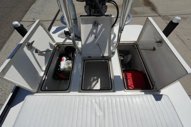 Slide: The Image of 2014 Maverick 17 HPX Tunnel boat storage compartments open, revealing equipment and supplies. - 14