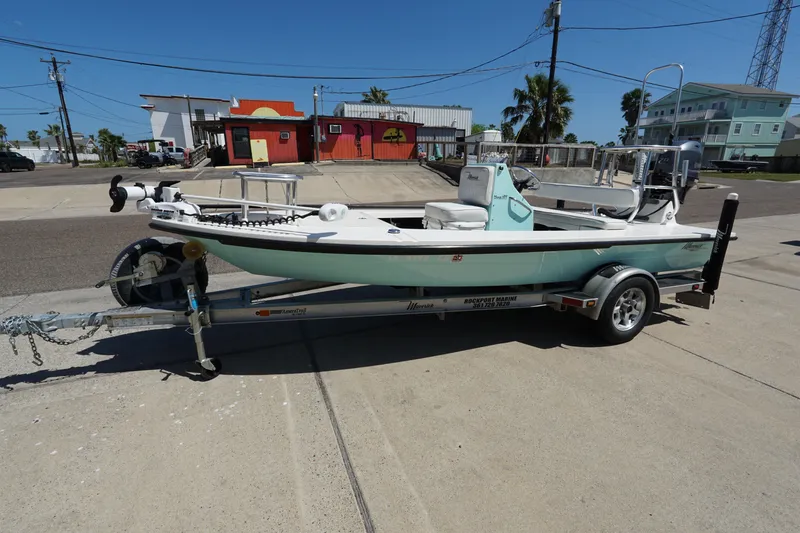 Slide: The Image of 2014 Maverick 17 HPX Tunnel boat on trailer, parked outdoors on a sunny day. - 2