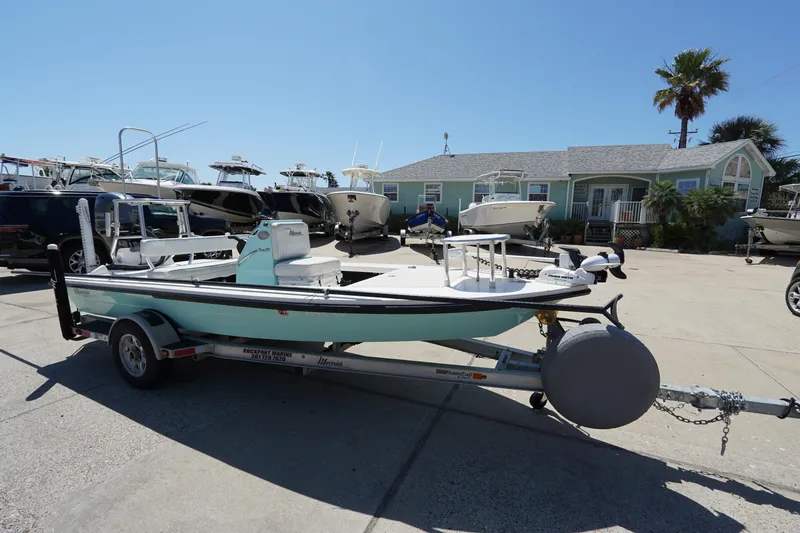 Slide: The Image of 2014 Maverick 17 HPX Tunnel boat on trailer in sunny marina setting. - 3