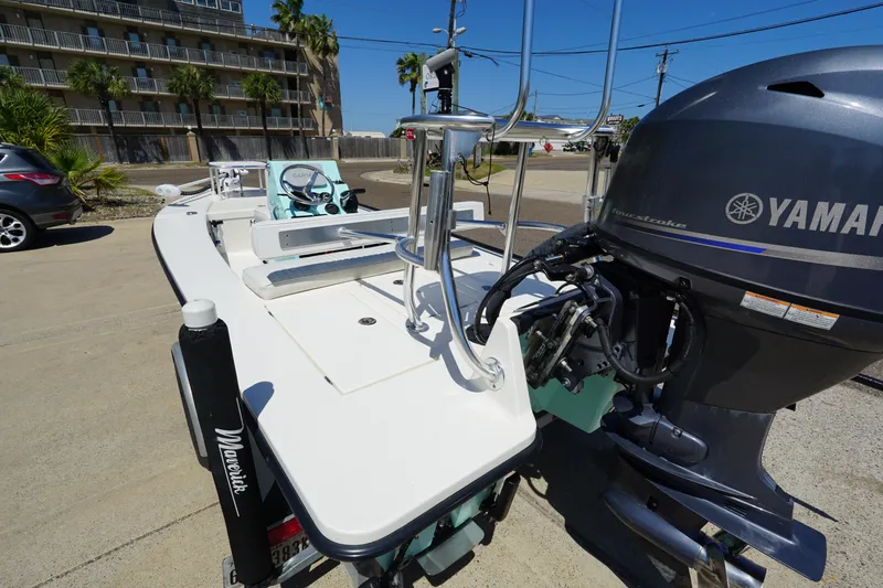 Slide: The Image of 2014 Maverick 17 HPX Tunnel boat with Yamaha outboard motor, parked outdoors. - 6