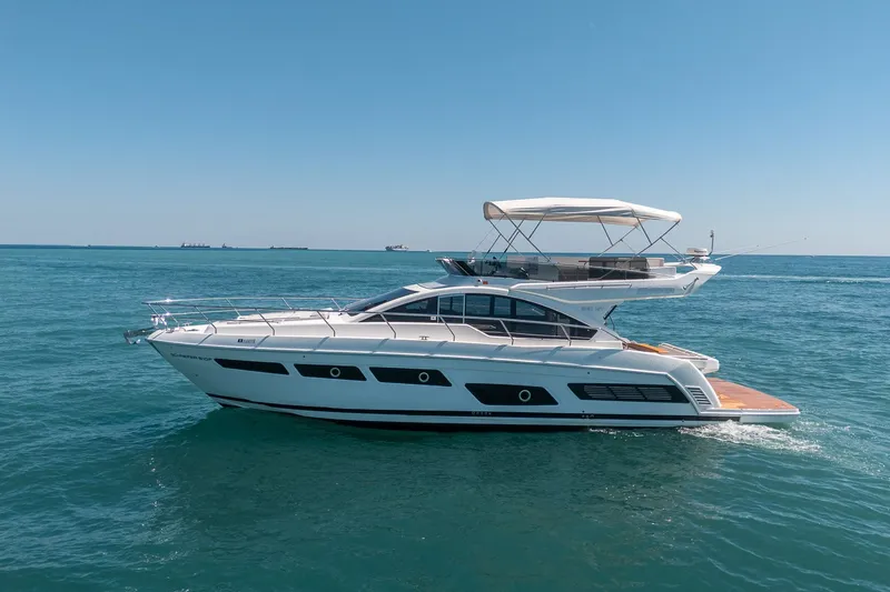 Slide: The Image of 2023 Schaefer 510 GT yacht cruising on open sea. - 12