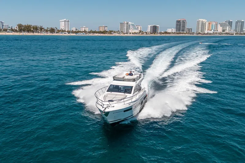 Slide: The Image of Schaefer 510 GT Yacht 2023 cruising fast on open sea. - 26