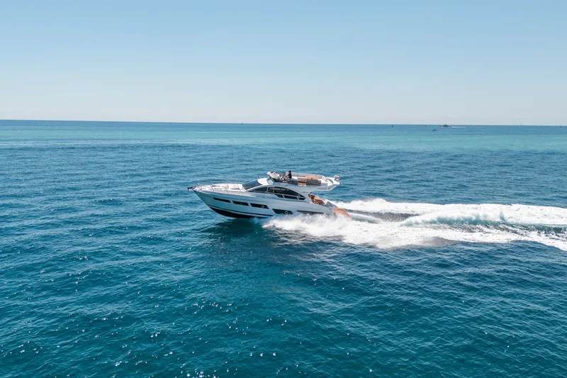 Slide: The Image of Schaefer 510 GT yacht 2023 cruising on open sea. - 28