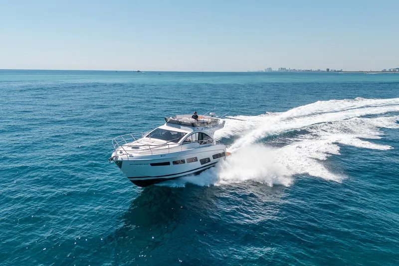 Slide: The Image of Schaefer 510 GT Yacht 2023 cruising on open sea. - 29