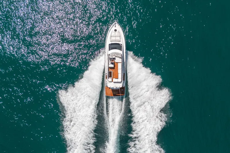 Slide: The Image of Aerial view of Schaefer 510 GT yacht cruising on the sea, 2023 model. - 32