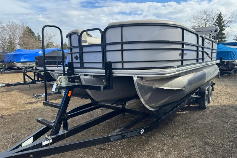 The Image of 2018 South Bay 200 pontoon boat on trailer, parked outdoors. - 1
