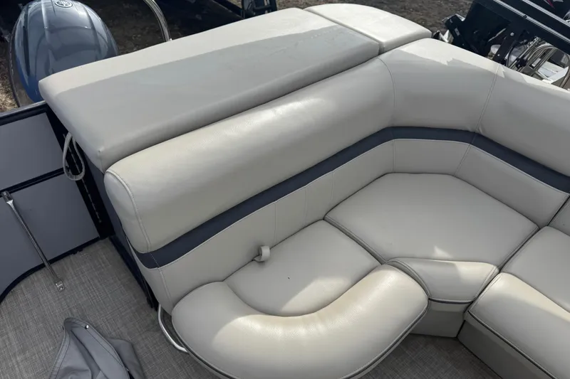 Slide: The Image of 2018 South Bay 200 boat interior with beige leather seating and blue accents. - 10