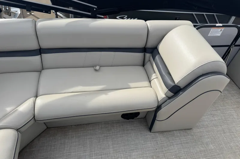 Slide: The Image of 2018 South Bay 200 boat interior with beige and gray seating. - 11