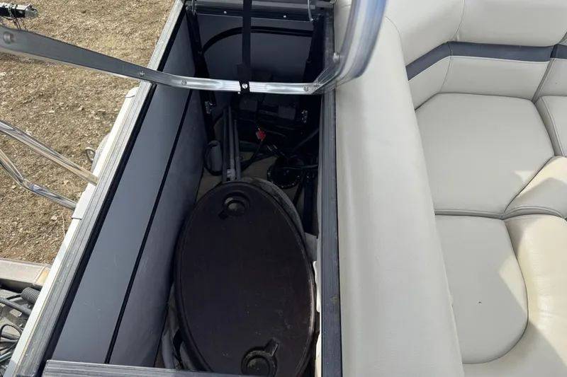 Slide: The Image of Storage compartment in a 2018 South Bay 200 boat with seating and equipment. - 14