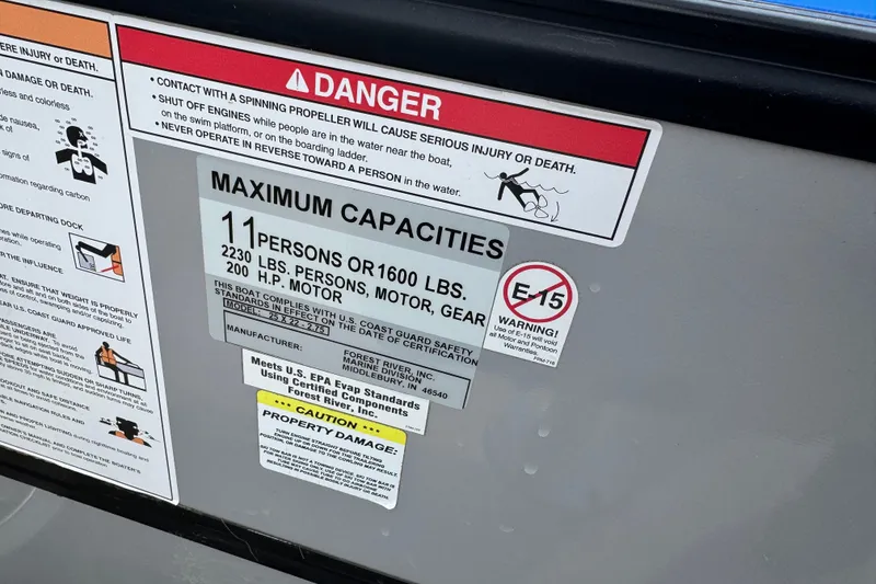 Slide: The Image of Safety and capacity warning labels on a 2018 South Bay 200 boat. - 15