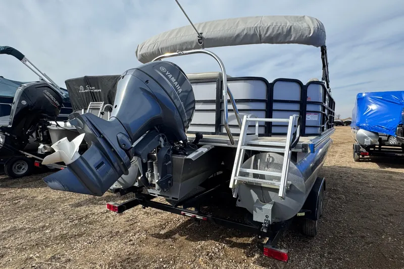 Slide: The Image of 2018 South Bay 200 pontoon boat with Yamaha outboard motor and ladder, parked on a trailer. - 3
