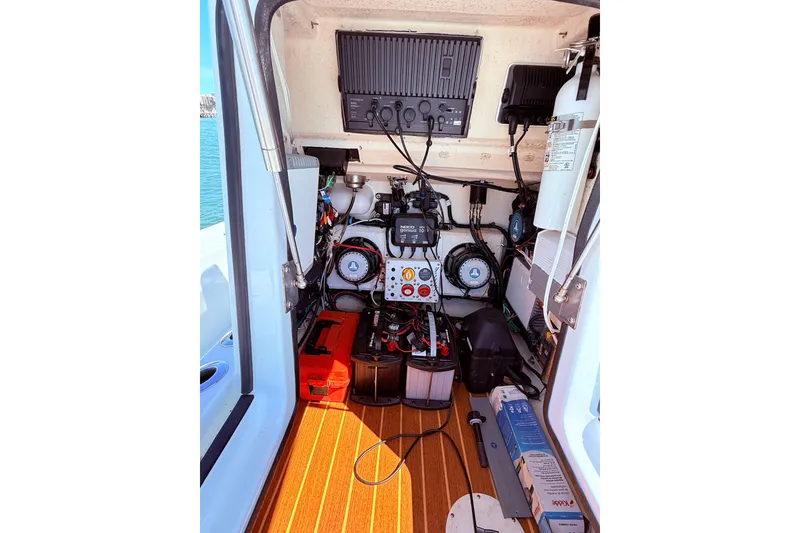 Slide: The Image of Interior view of a 2014 Yellowfin 24 Bay boat's electrical and mechanical systems. - 10