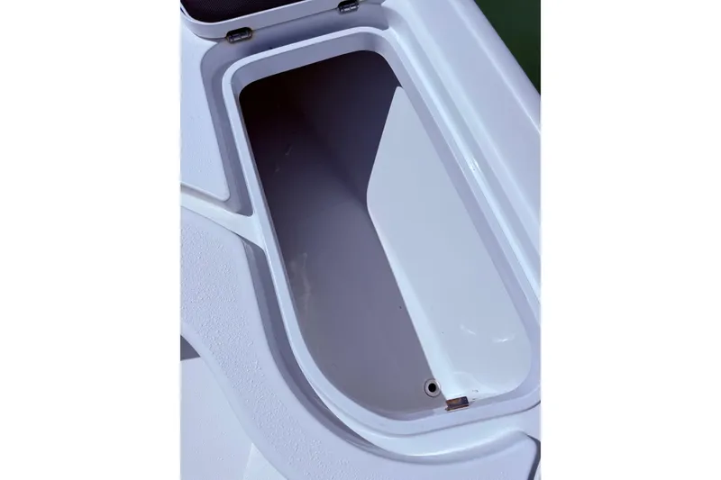 Slide: The Image of Open storage compartment on a 2014 Yellowfin 24 Bay boat. - 12