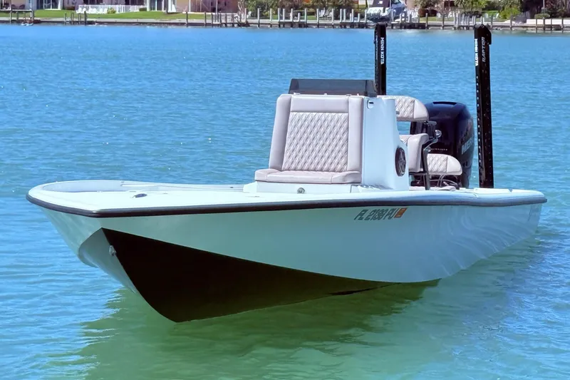Slide: The Image of 2014 Yellowfin 24 Bay boat floating on clear blue water. - 4