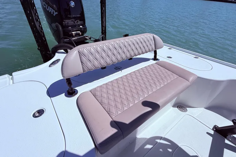 Slide: The Image of 2014 Yellowfin 24 Bay boat with quilted seating, Mercury engine, on calm water. - 7