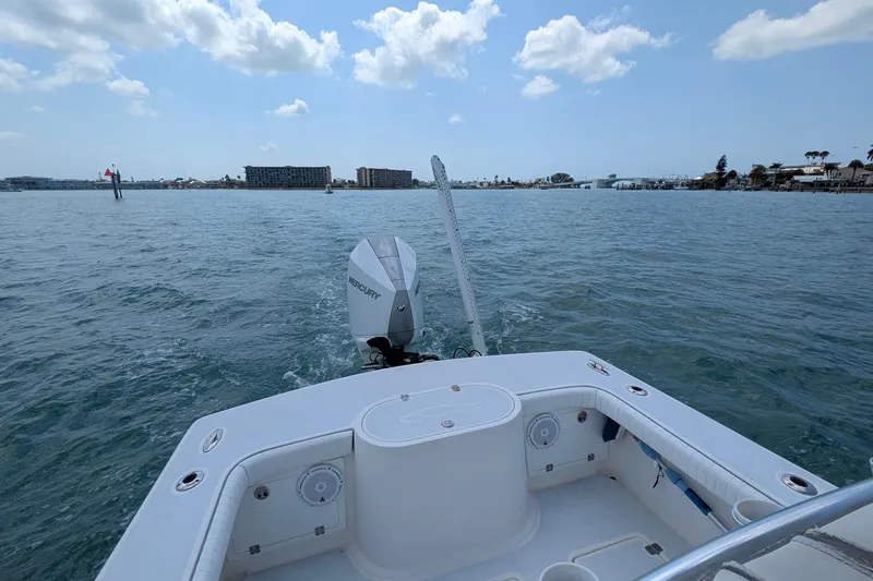 Slide: The Image of 2012 Gause Built 26 Center Console boat on open water, clear sky, distant shoreline. - 17