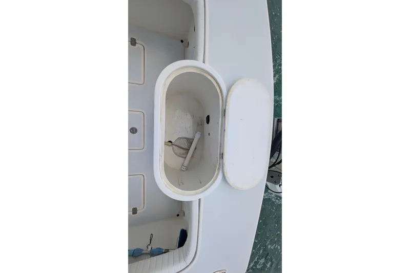 Slide: The Image of Open storage compartment on 2012 Gause Built 26 Center Console boat. - 20