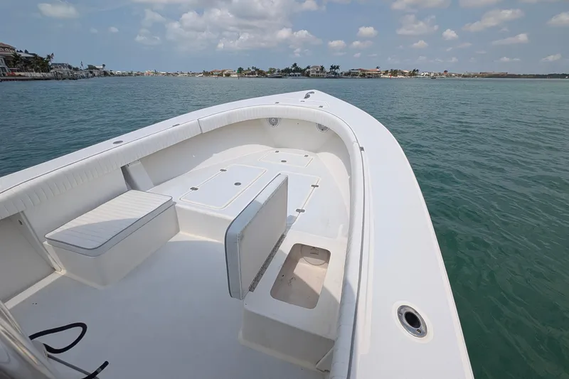 Slide: The Image of 2012 Gause Built 26 Center Console boat on calm waters under a partly cloudy sky. - 24