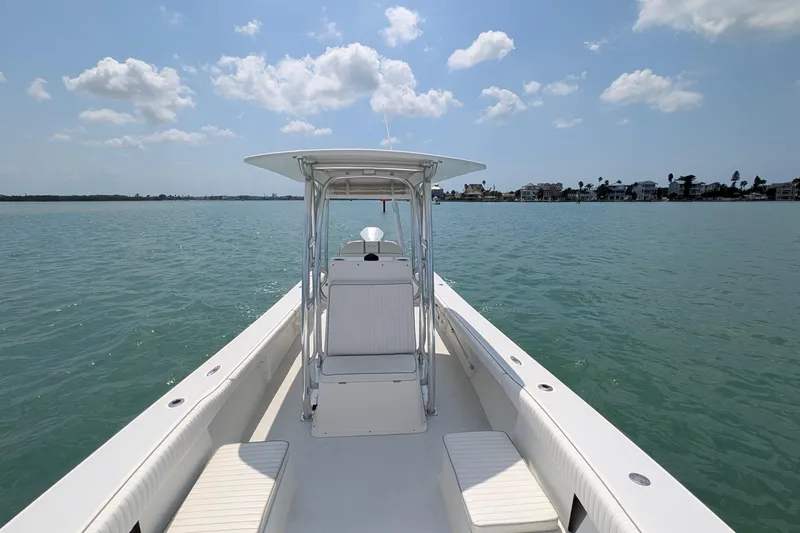 Slide: The Image of 2012 Gause Built 26 Center Console boat on calm water under a blue sky. - 30