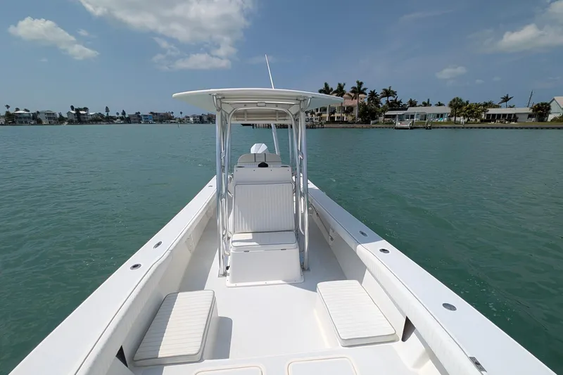 Slide: The Image of 2012 Gause Built 26 Center Console boat on calm water, clear sky background. - 31