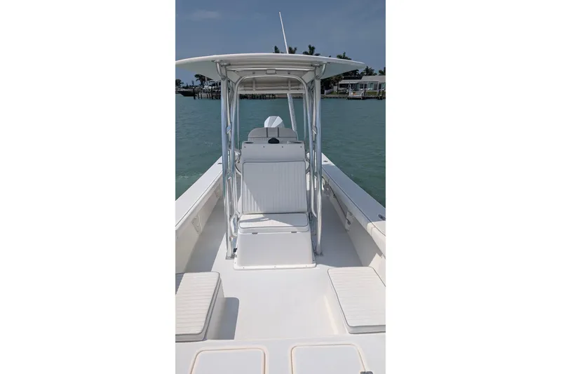 Slide: The Image of 2012 Gause Built 26 Center Console boat on calm water, featuring sleek design and spacious deck. - 32