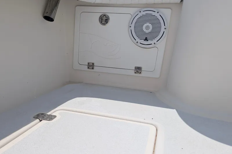 Slide: The Image of 2012 Gause Built 26 Center Console boat interior with speaker and storage compartment. - 34