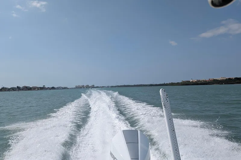 Slide: The Image of Gause Built 26 Center Console boat cruising on open water, leaving a wake behind. - 40