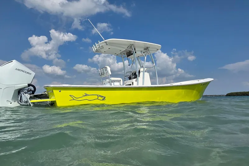 Slide: The Image of 2012 Gause Built 26 Center Console boat on water, featuring a vibrant yellow hull. - 9