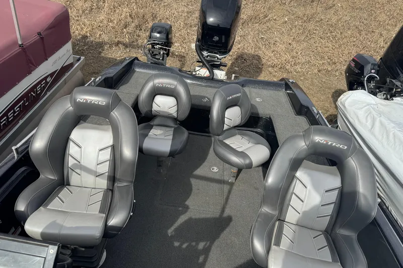 Slide: The Image of Four gray seats on a 2018 Nitro ZV21 boat deck. - 17