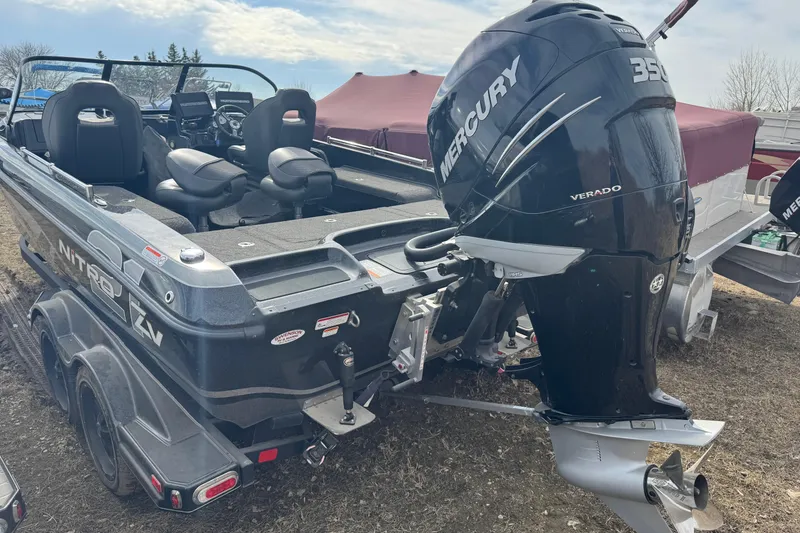 Slide: The Image of 2018 Nitro ZV21 boat with Mercury 350 Verado engine, parked on a trailer. - 4
