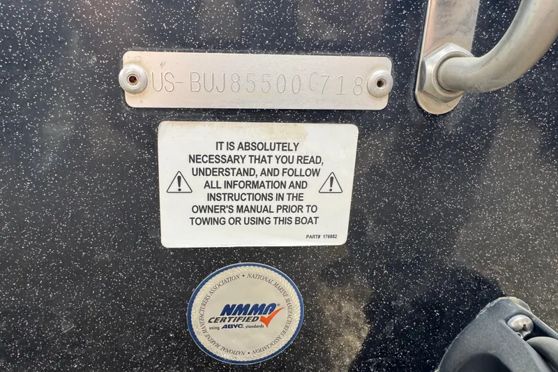 Slide: The Image of 2018 Nitro ZV21 boat warning label and certification sticker on speckled surface. - 5