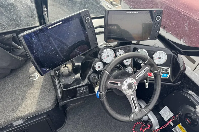 Slide: The Image of 2018 Nitro ZV21 boat dashboard with steering wheel and Humminbird displays. - 7