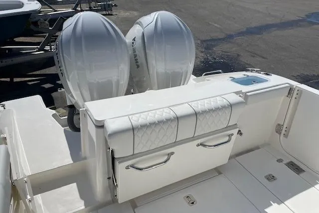 Slide: The Image of 2026 Pursuit S 288 Sport boat with dual outboard engines and cushioned seating. - 5