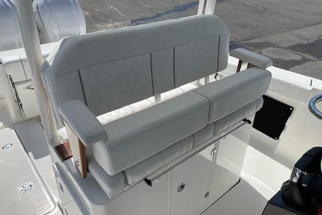 Slide: The Image of 2026 Pursuit S 288 Sport boat with white cushioned seating and sleek design. - 7