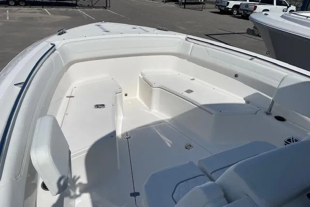Slide: The Image of 2026 Pursuit S 288 Sport boat interior with white seating and spacious deck. - 9