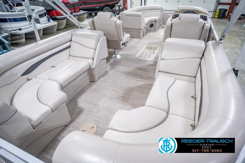 Slide: The Image of Interior of a 2018 Bennington 23 SSRX pontoon boat with beige seating. - 14