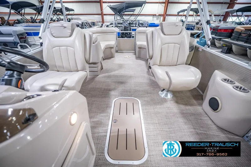 Slide: The Image of 2018 Bennington 23 SSRX pontoon boat interior with beige seating and carpeted flooring. - 17