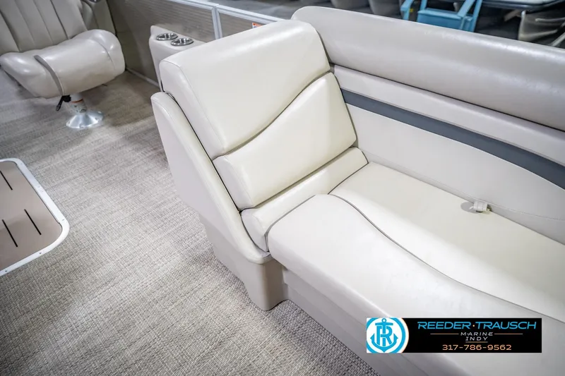 Slide: The Image of 2018 Bennington 23 SSRX boat interior with beige seating and carpeted flooring. - 23