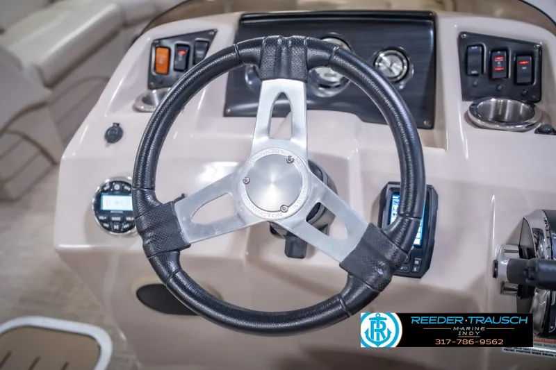 Slide: The Image of Steering wheel and dashboard of 2018 Bennington 23 SSRX boat. - 29