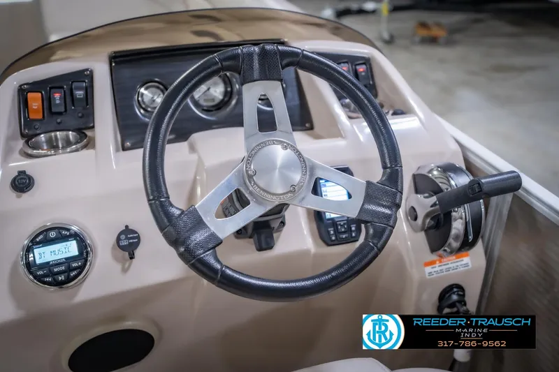 Slide: The Image of Steering console of a 2018 Bennington 23 SSRX boat with controls and gauges. - 30