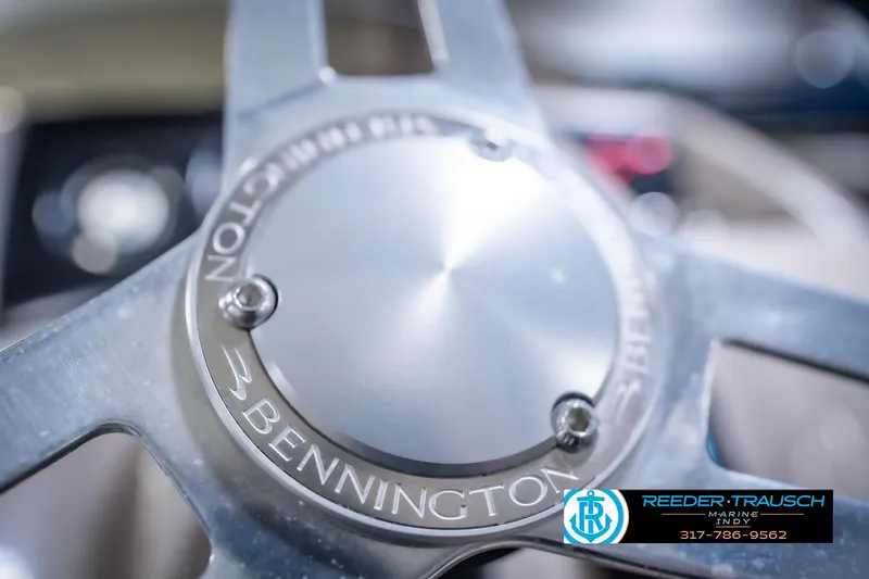 Slide: The Image of Close-up of 2018 Bennington 23 SSRX steering wheel with Reeder-Trausch Marine logo. - 31