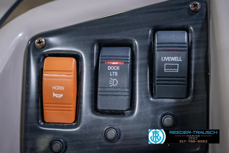 Slide: The Image of Control panel of a 2018 Bennington 23 SSRX with horn, dock lights, and livewell switches. - 33