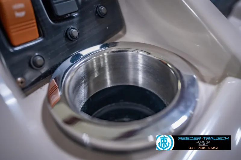 Slide: The Image of Close-up of a 2018 Bennington 23 SSRX boat's cup holder and control panel. - 43