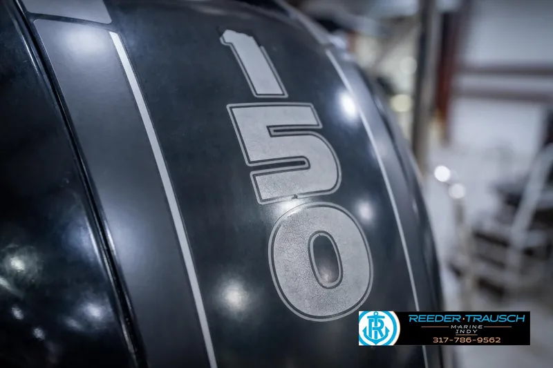 Slide: The Image of Close-up of a 150 HP engine on a 2018 Bennington 23 SSRX boat. - 49