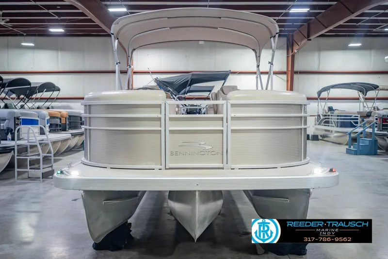 Slide: The Image of 2018 Bennington 23 SSRX pontoon boat in showroom, front view. - 5