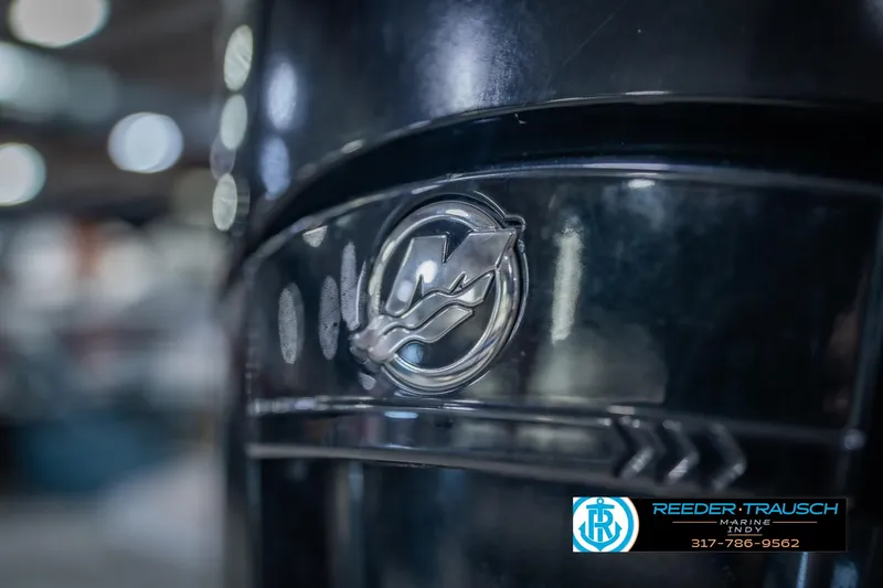Slide: The Image of Close-up of a 2018 Bennington 23 SSRX boat emblem with dealership logo. - 50