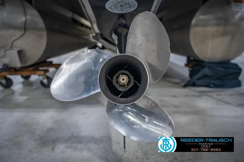 Slide: The Image of Close-up of a 2018 Bennington 23 SSRX boat propeller in a workshop setting. - 51